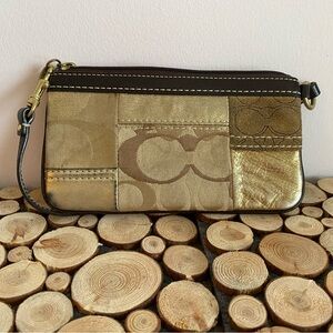 Brown and gold coach wristlet